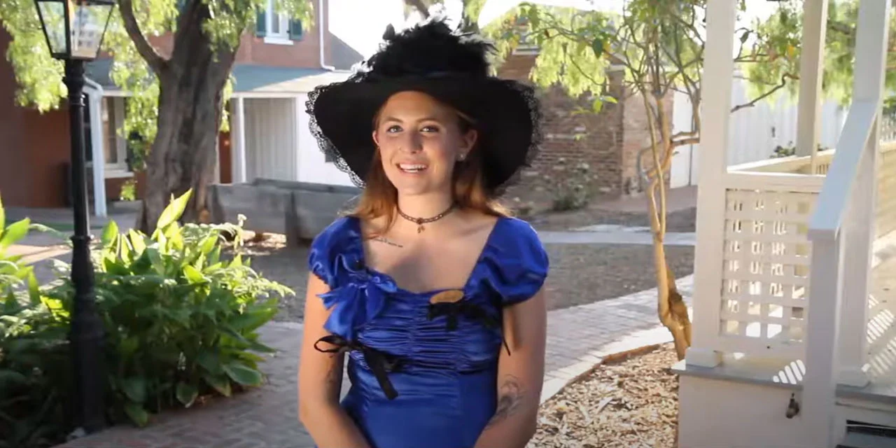 Rebecca, costumed ghost host